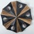Beautiful and graphical star-shaped wall or ceiling lamp, made with dark brown and brown ceramic, manufactured in the...