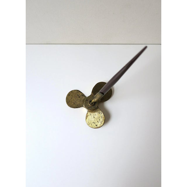 A solid brass nautical style (boat) propeller pen holder, circa mid-20th century. A great accessory for a desk,...