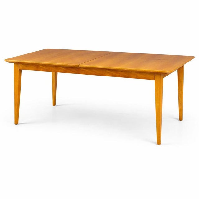 A beautifully crafted mid-century walnut extending dining table by Gordon Russell, one of Britain’s most respected...