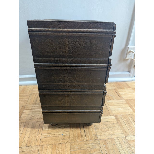 Unique design. Four faux suitcases stacked. Each unit has four drawers. The two items are unmarked by the maker.