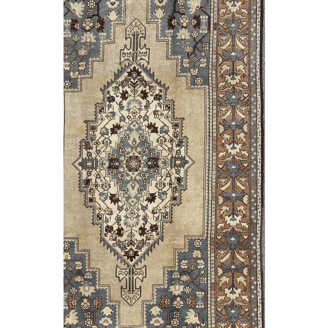 Vintage Turkish Medallion Oushak Rug in Rustic Blue, Mocha, and Taupe Measures: 7'2 x 12'9 Unique in its color palette and...