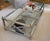 Transitional glass and metal coffee table - mostly silver with a bronze accents. Dimensions: 60" x 30" x 16"