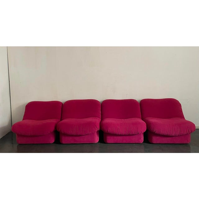Wrapped in striking magenta upholstery, this four-piece Italian modular seating arrangement delivers pure 1970s...
