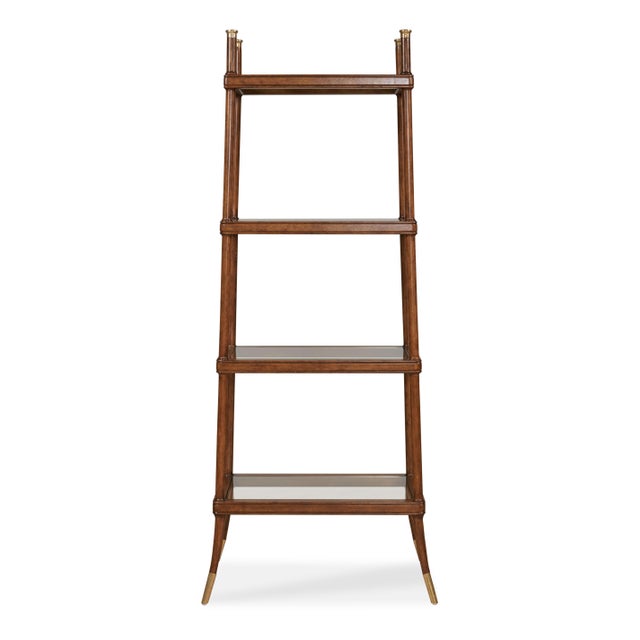 A sculptural étagère that blends lightness and structure. Its tall, tapered oak frame and gently flared legs create an...