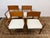 Design Plus Gallery presents a Set of Four Mid Century Modern Chairs. The set of chairs has a nice honey brown tone of...