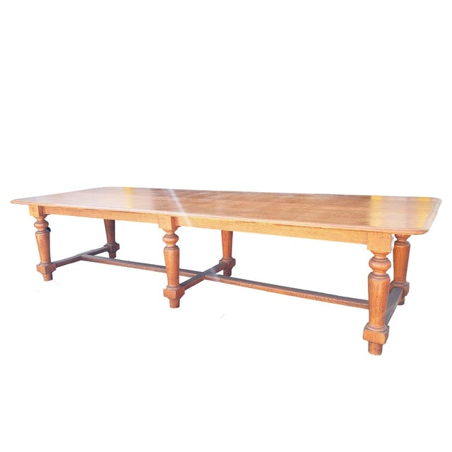 Impressive in scale and rich in character, this hand-carved oak farmhouse dining table hails from the South Shore of...