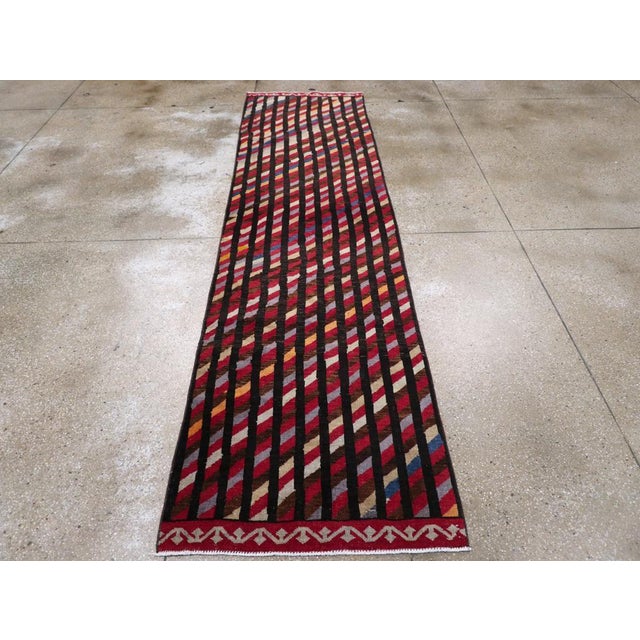 A vintage Turkish Art Deco style runner handmade during the mid-20th century. Measures: 2' 11" x 11' 5"