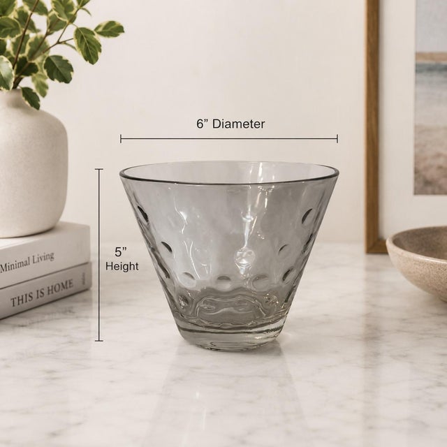 This mid-century hand-blown art glass bowl showcases a sculptural optic bubble pattern created through controlled air...