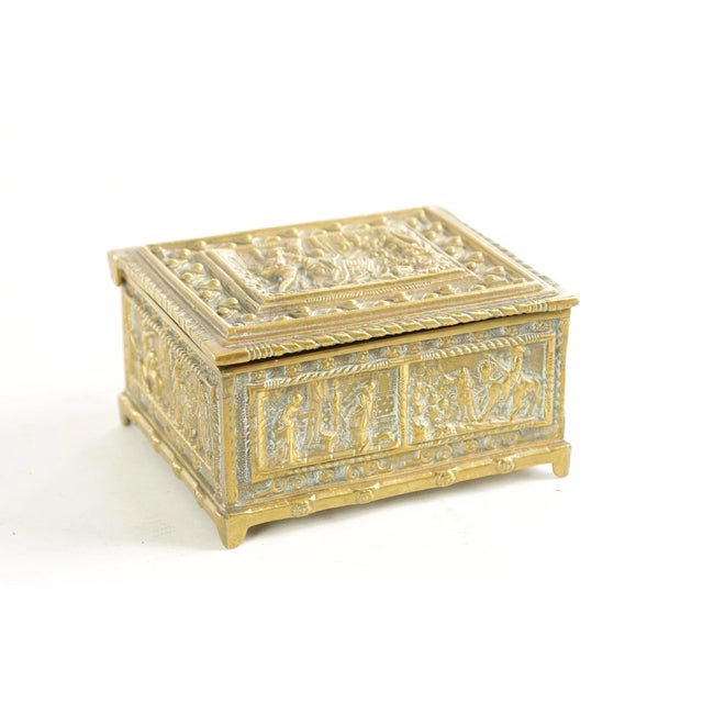 19th-Century French or German Brass Casket with Repousséed Classical Figures A handsome and finely worked brass casket...
