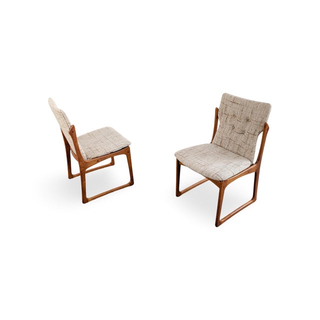 We are offering a beautiful set of two vintage Danish chairs from the 1960s for sale. These upholstered chairs were...
