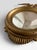 This 1970s Sexton Company federal design styled gold convex mirror is made from cast metal. Eerily similar to the Antique...