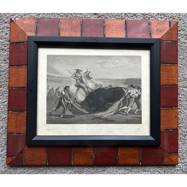 Antique original print of a Spanish bullfight with a horse in a coliseum. In newer decorative wood frame.