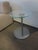 The Coalesse Await Glass Side Table expresses minimalist sophistication through its pared-down design. A clear glass top...