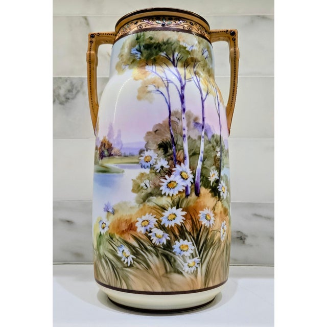 Beautiful antique Art Nouveau Nippon porcelain tankard vase, hand painted with a serene lakeside landscape featuring birch...