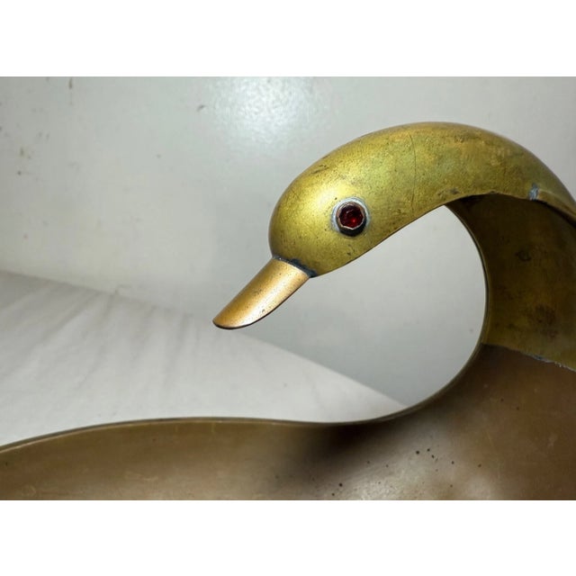 This antique handmade copper and brass Mexican centerpiece bowl features a unique stylized swan design, adding a touch of...