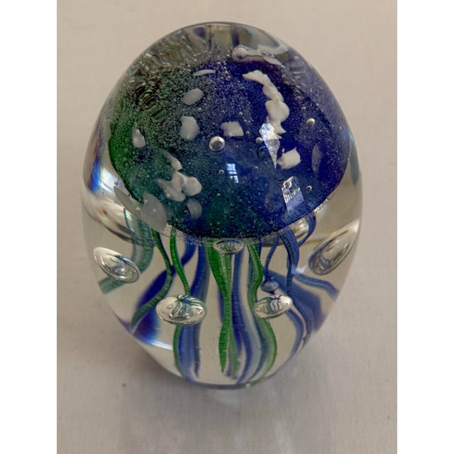 This blue and green jellyfish paper weight, after Murano Art Glass, was expertly crafted with perfectly controlled bubbles...