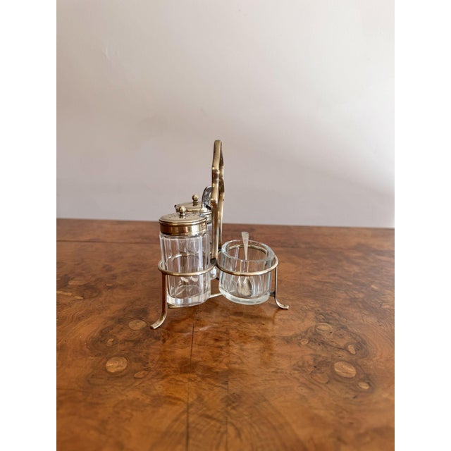 Elegant quality antique Edwardian cruet set, having a quality antique Edwardian cruet set with a silver plated stand with...