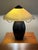 This Mission style arts and crafts hammered bronze metal amber light table lamp makes a statement in the room. It casts a...