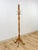 This elegant vintage brass and wood coat rack with porcelain cream knobs is a refined and characterful entryway find. The...