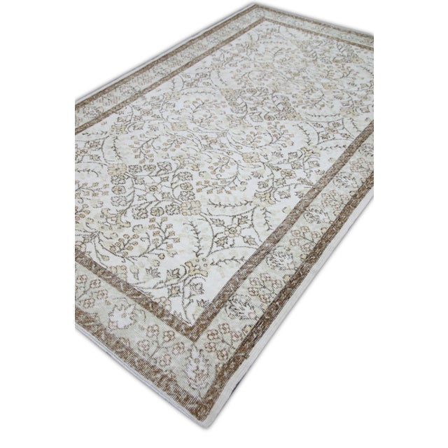 Introducing a one-of-a-kind vintage Turkish hand-knotted wool rug, carefully crafted by skilled artisans using traditional...