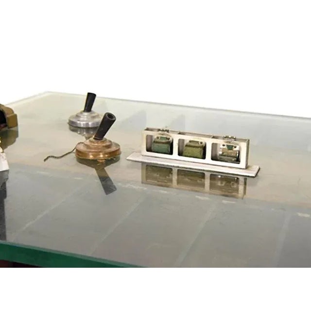 Antique glass top bank table having scrolled and paneled supports raised on marble block feet, original pen and inkwell...