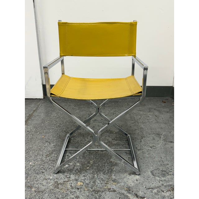 Design Plus Gallery presents a Vintage Director Style Yellow Armchair. This chair has a chrome-tone metal frame, squared...