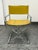 Design Plus Gallery presents a Vintage Director Style Yellow Armchair. This chair has a chrome-tone metal frame, squared...