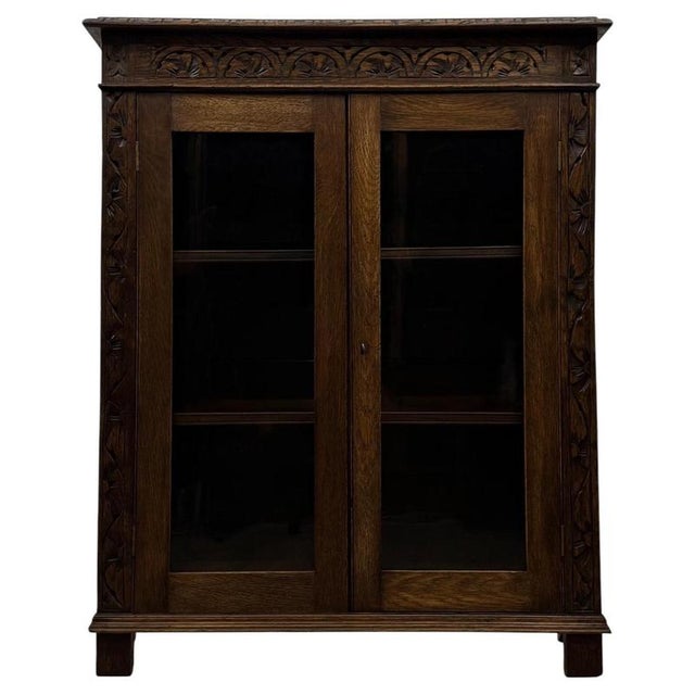 An outstanding 19th-century Victorian carved oak display cabinet, exceptionally well made and distinguished by its...