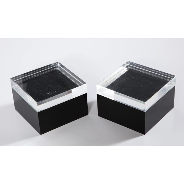 A pair of 1970s modernist Albrizzi decorative boxes with black Lucite bases and clear lids. Perfect as a trinket or...