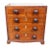 Rectangular top and two over three drawers with wood knobs. Bracket feet.