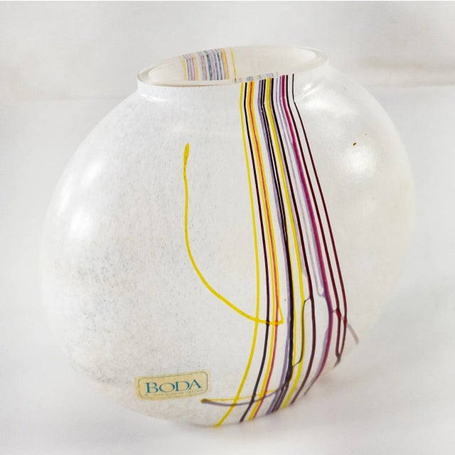 We are offering this attractive art glass vase by Kosta Boda. This Mid Century vase has great style with frosted white...