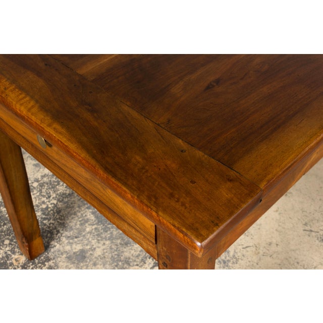 Sourced in Provence, France, this substantial late 19th century French Provincial farmhouse table is crafted from solid...