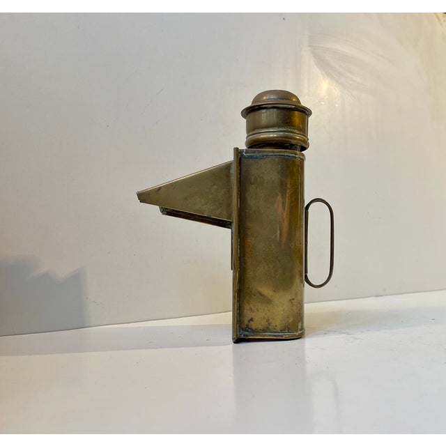 A rare hand-held mining or ship lantern in patinated brass. Despite being around 100 years old it has an almost futuristic...