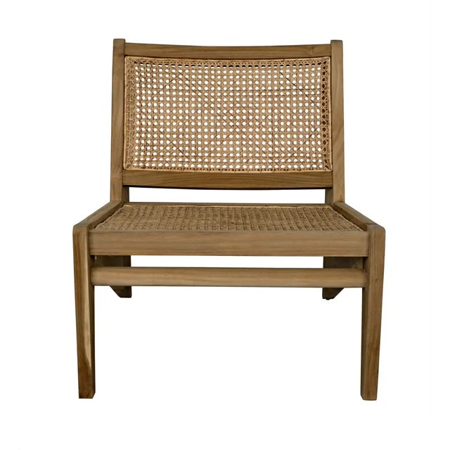 Geometric lines, natural teak, and caning are combined in this relaxed occasional chair inspired by tropical modernism....