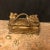 Perfect for gifts, jewelry, desk storage, on a table, or in a cabinet / bookcase. Gold Colored Metal Hinged Box With...
