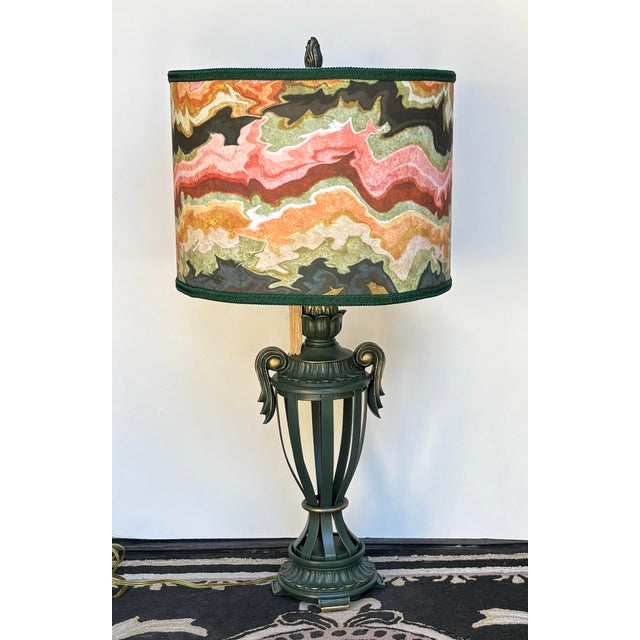 Gorgeous heavy iron open urn design lamp with a one of a kind shade. The shade is amazing, very pretty when it's off and...