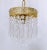 This is an Italian brass rim chandelier dressed with octagon chain and Strauss plug cut crystals drops. It has 1 Edison...