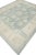 Enhance your living space with the luxurious charm of this Handmade Modern Turkish Oushak Rug. Measuring 8'2" x 9'2", this...