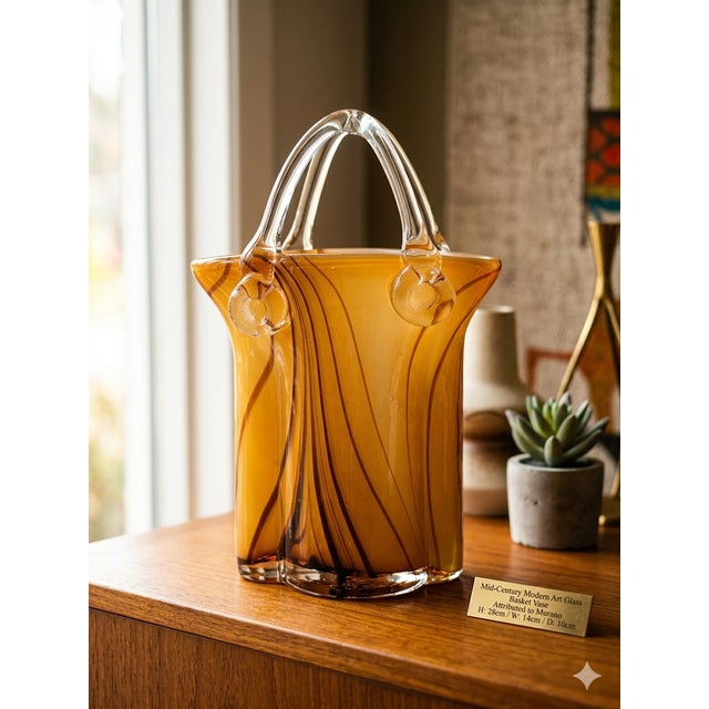 An exceptional and highly decorative mid-century modern art glass vase with an elegant basket shape, dating from the...