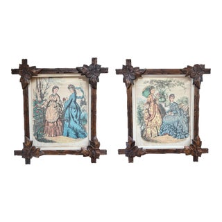 Pair of Victorian Fashion Engravings in Carved Black Forest Frames, 19th C. For Sale