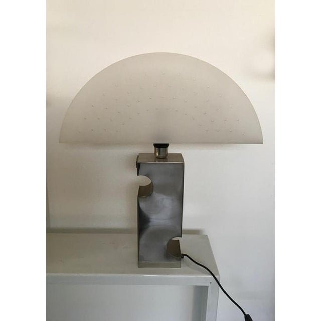 This beautiful table lamp is a unique piece products in the 1970 by an Italian factory. It is a prototype of a collection...