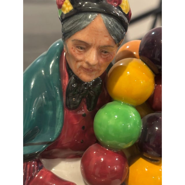 A beloved Royal Doulton classic, “The Old Balloon Seller” (HN1315) was designed by renowned sculptor Leslie Harradine and...