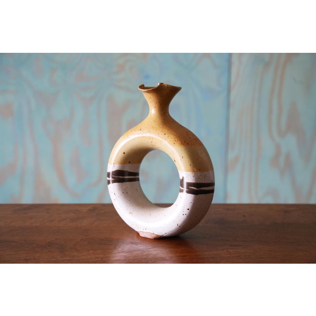 A studio ceramic vase with a unique shape and beautiful glaze pattern. The vase has a cork stopper so could also double as...