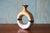 A studio ceramic vase with a unique shape and beautiful glaze pattern. The vase has a cork stopper so could also double as...
