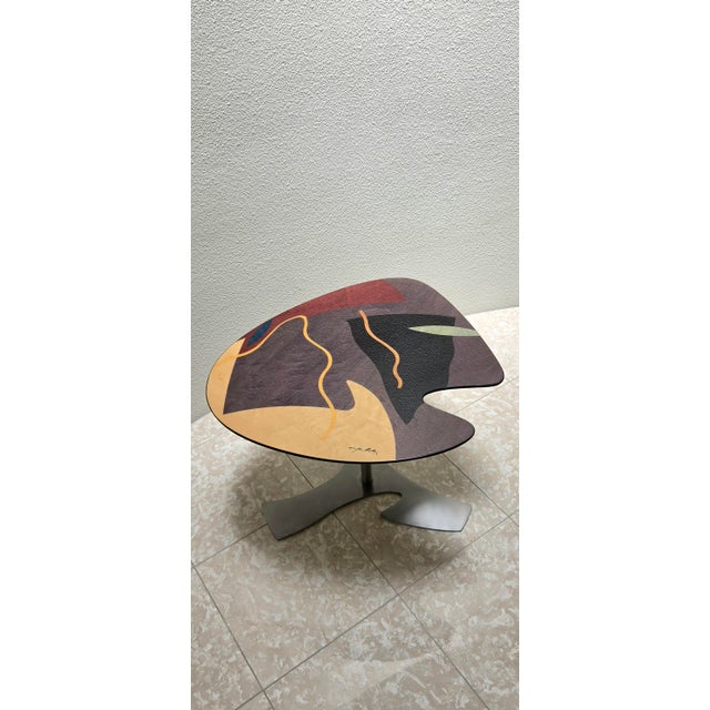 Carlo Malnati colorful inlay/wood marquetry table. Malnati signature visible on tabletop. Blobby shape typical of the...