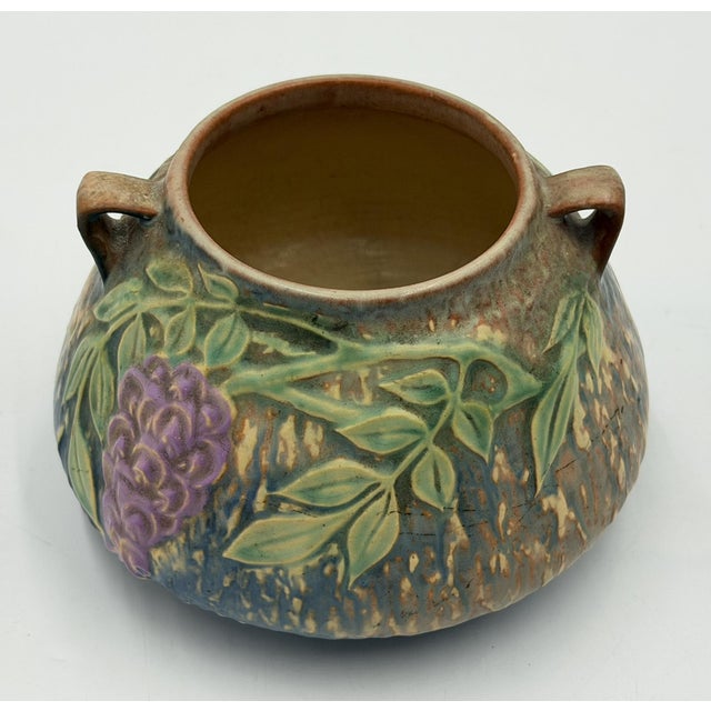 A classic example of American Art Deco pottery, this Roseville Pottery Wisteria vase dates to the early 1930s and features...