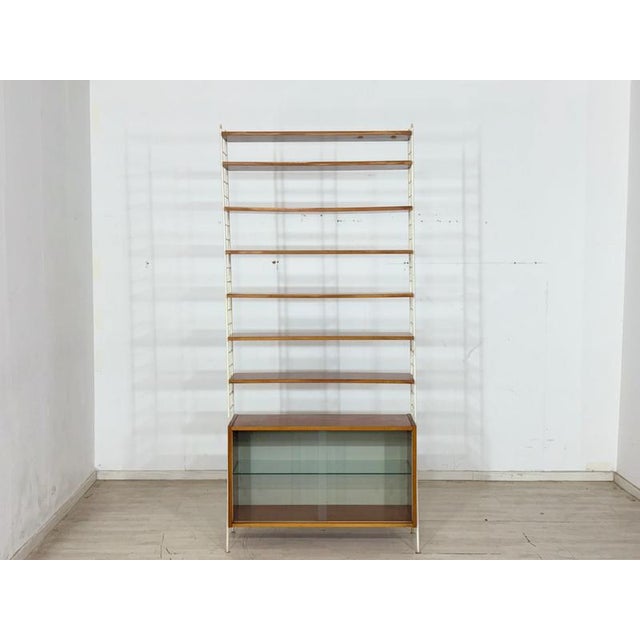 For sale is this original mid-century wall shelf from the iconic "Sybille" series, manufactured on December 8, 1966, by...