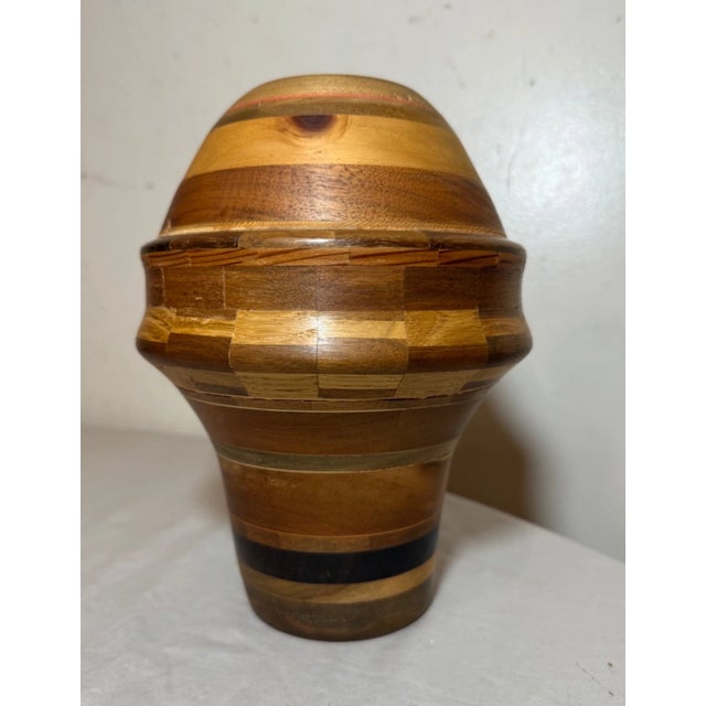 Up for sale is a unique and handmade vintage turned natural wood artisan vase. This lovely modernist vase features many...