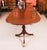 This is an elegant antique late Victorian three pillar Regency Revival flame mahogany dining table, circa 1900 in date....