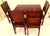 A unique set: a massive table and 4 chairs made of solid exotic wood, rosewood. The furniture features beautiful grain, a...
